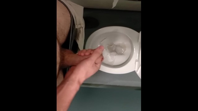 Risky, jerking off and cumming in a public toilet in the middle of the day